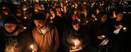  At a candlelight vigil outside the home of Baylor University President Ken Starr on Feb. 8,...