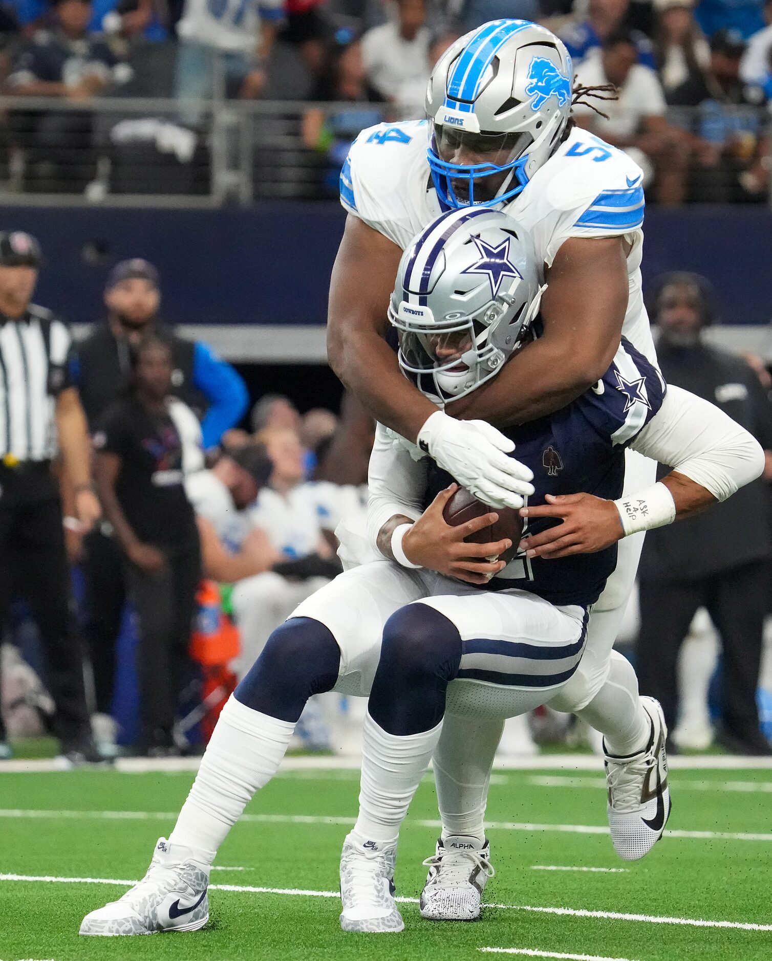 Dallas Cowboys quarterback Dak Prescott (4) is sacked by Detroit Lions defensive tackle Alim...