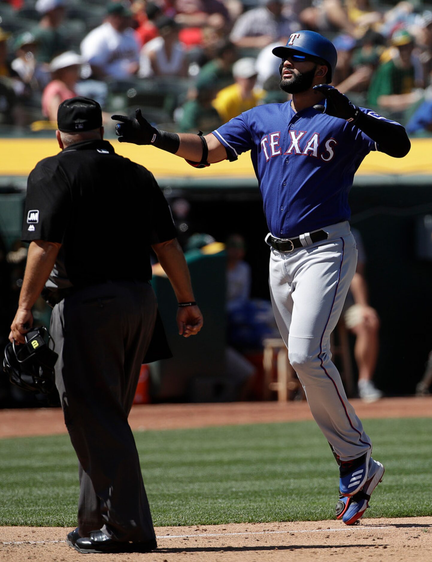 Texas Rangers' Nomar Mazara, right, celebrates after hitting a solo home run against the...