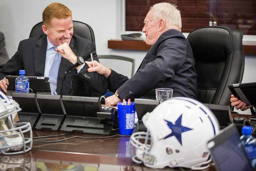 Dallas Cowboys head coach Jason Garrett (left) laughs with owner Jerry Jones in the team's...