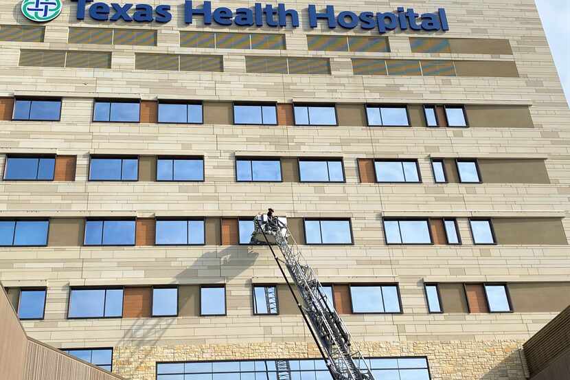 North Texas firefighters paid their colleague Capt. Troy Hammons a visit at Texas Health...