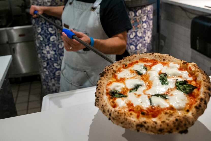 Chef Dino Santonicola prepares a margherita pizza at Partenope Ristorante in downtown Dallas.