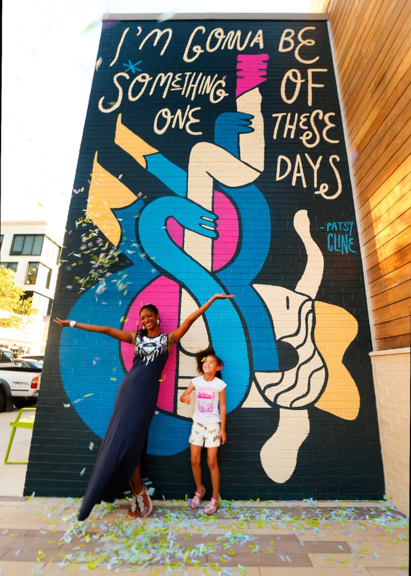 Jennifer Gilmore and her daughter Jocelyn, 6, of Fort Worth pose for a selfie in front of a...