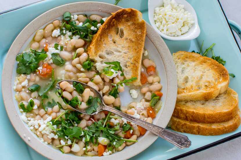 Instant Pot White Bean Soup with Greens and Goat Cheese is made with dried beans.