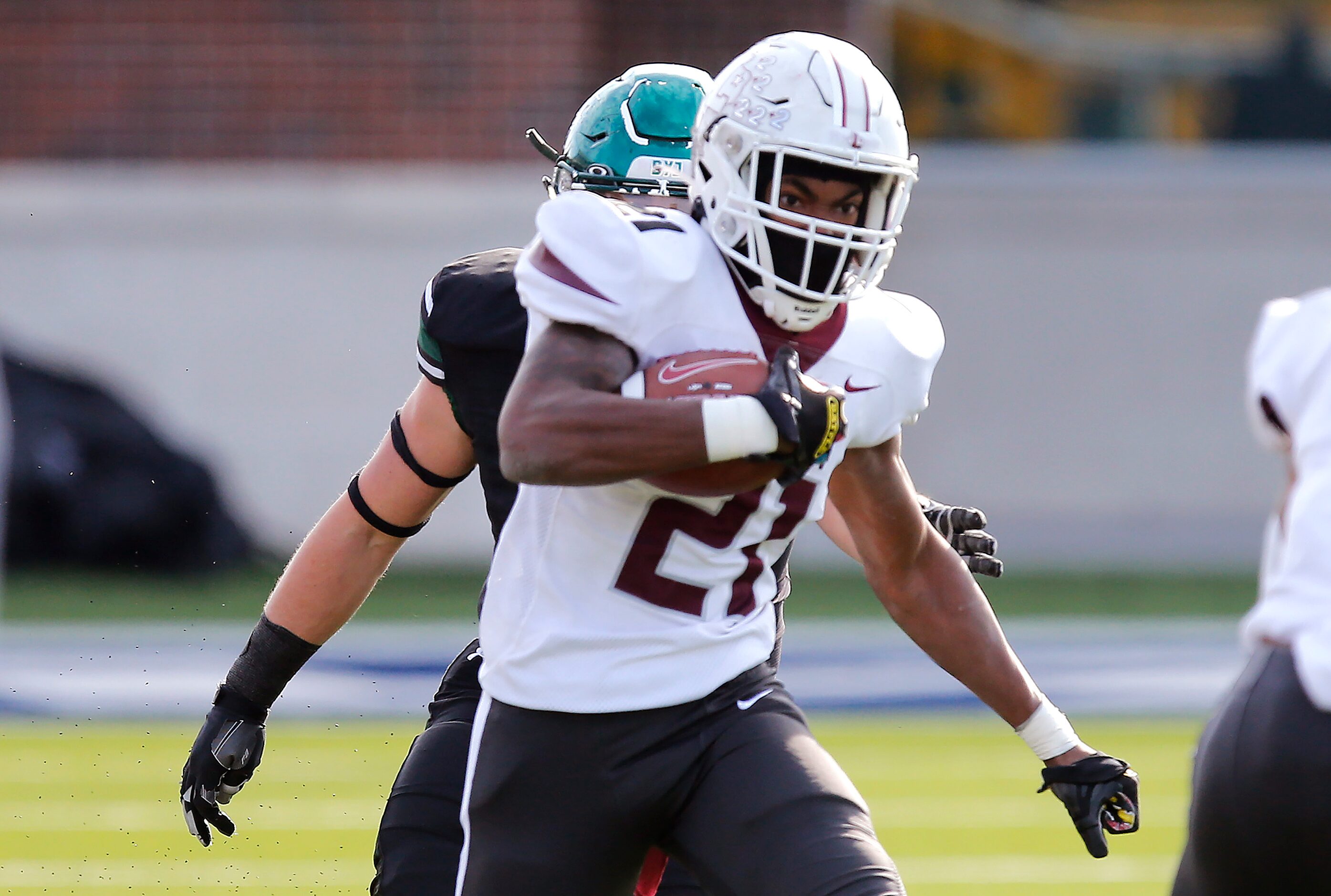 Lewisville High School’s Viron Ellison (21) runs the ball during the first half as Prosper...