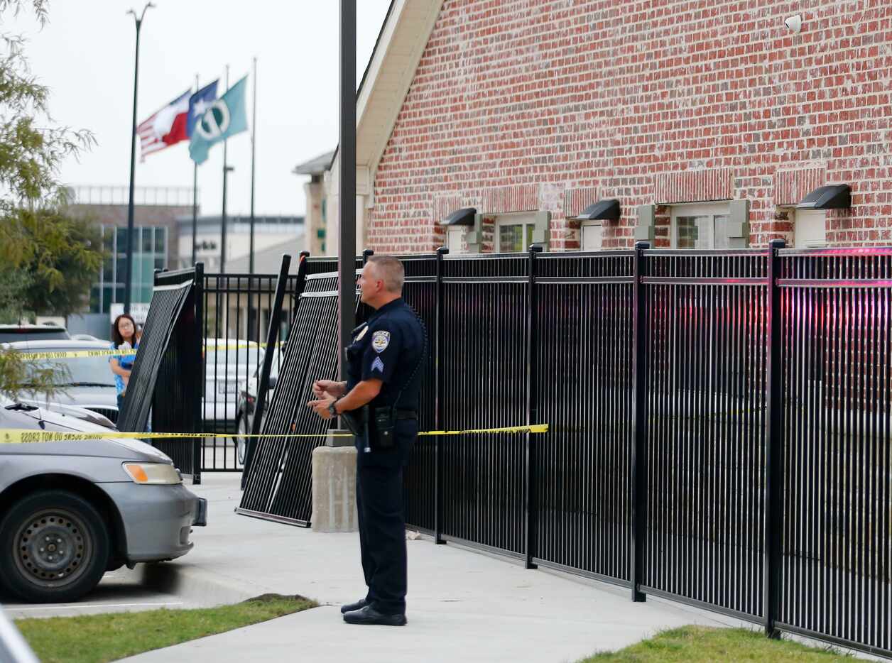 A broken fence is shown where a vehicle ran into it at Primrose School of Frisco at Main and...