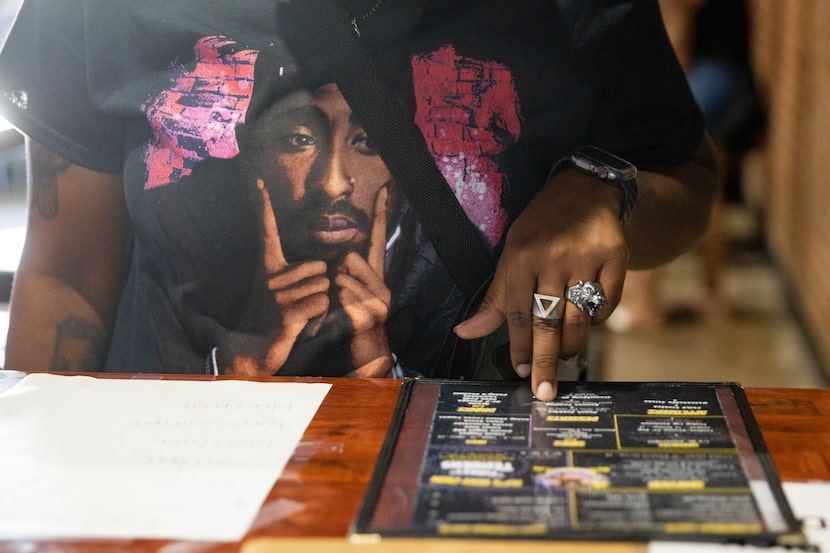 Customer Tiffany Taylor wears a Tupac shirt while pondering the menu at Turkey Leg Paradise.