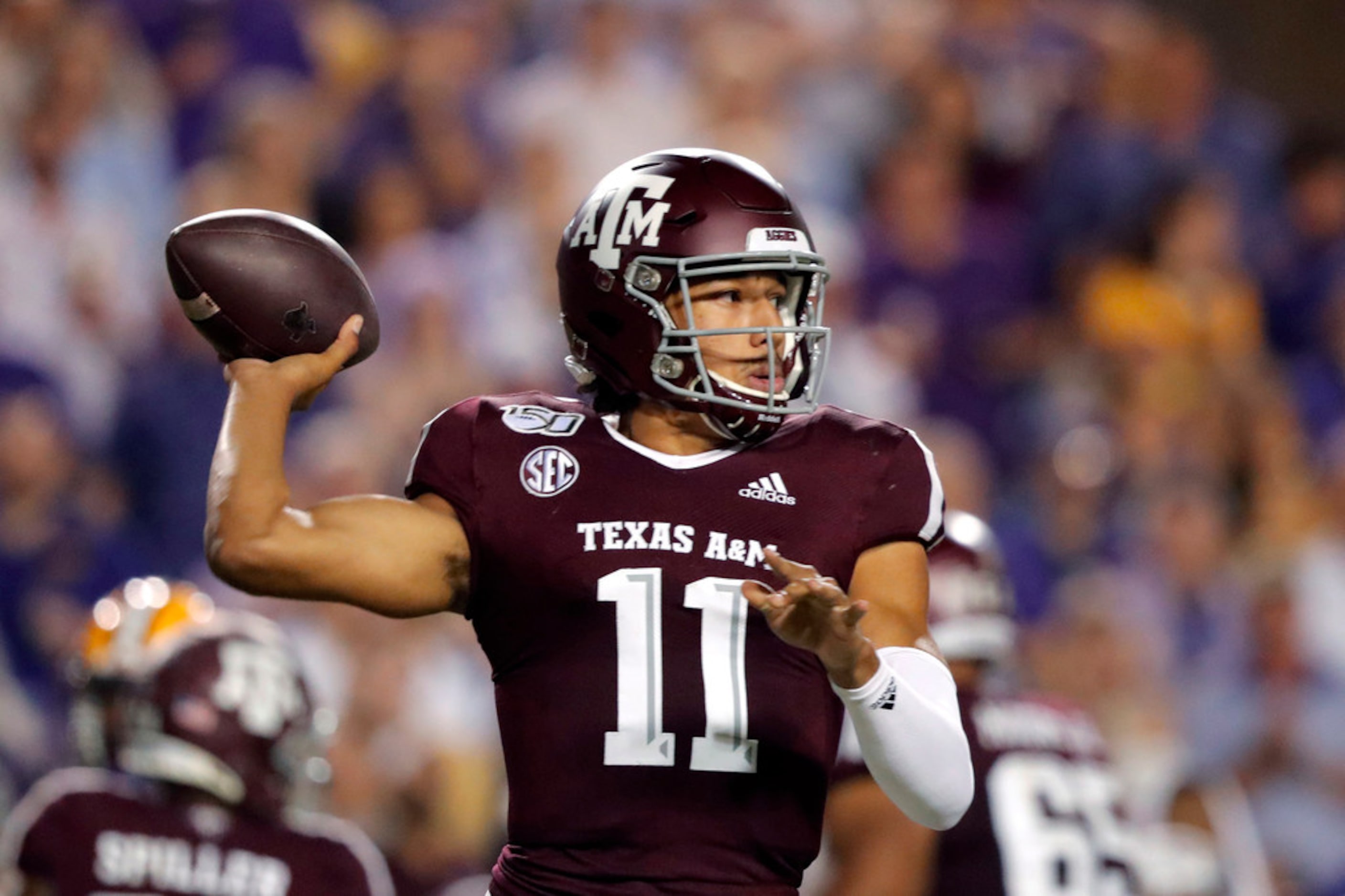 Texas A&M quarterback Kellen Mond (11) throws a pass during the first half of the team's...