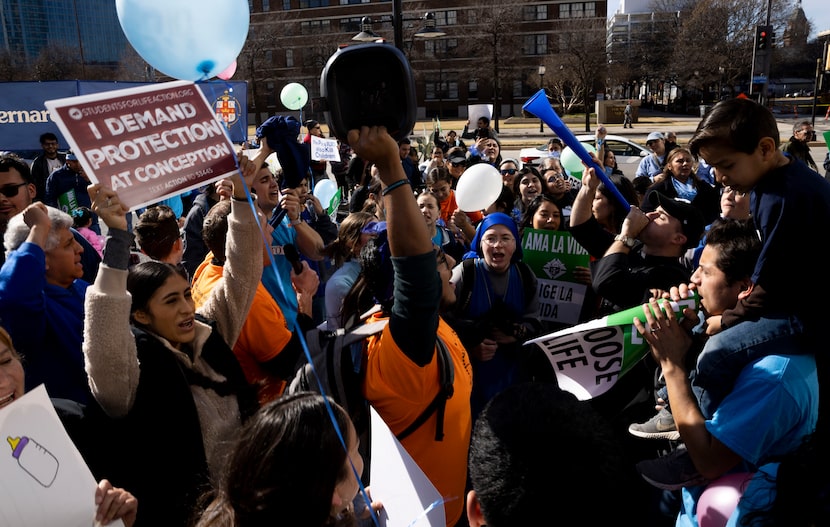 Bernie Gonzalez leads other members of St. Bernard of Clairvaux Catholic Church as they...