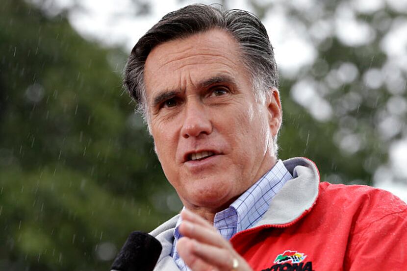 Republican presidential candidate Mitt Romney campaigns in the rain on Sept. 14 at Lake Erie...