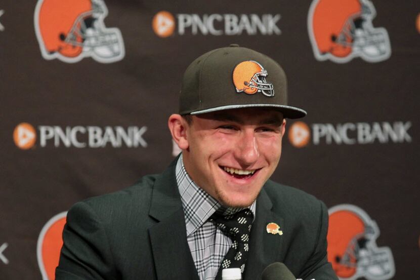 Cleveland Browns first round draft choices Johnny Manziel flashes his smile for members of...
