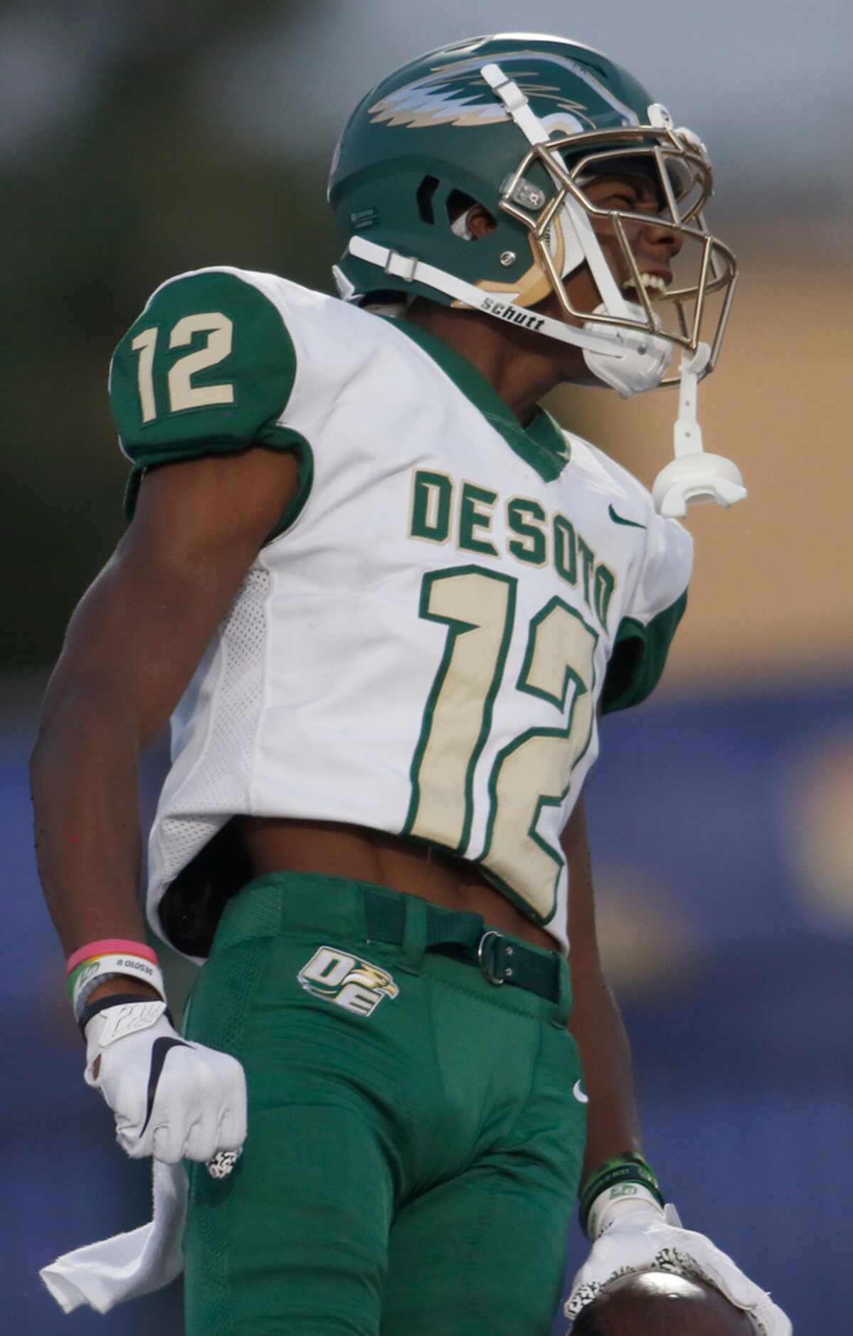 DeSoto receiver Jaedon Wilson (12) lets out a yell after scoring on a 70-yard touchdown...
