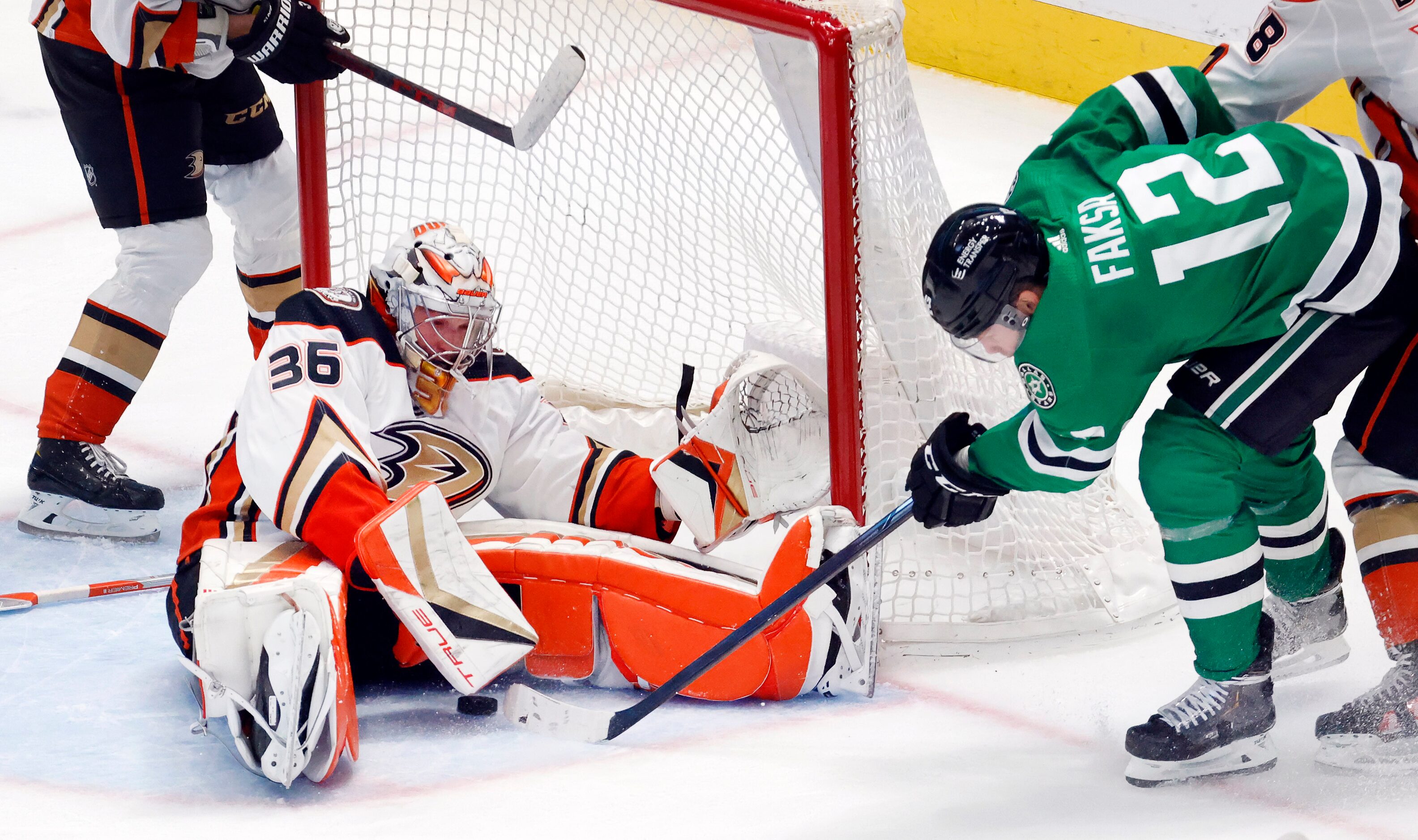 Dallas Stars center Radek Faksa (12) tries to stick a rebound under Anaheim Ducks goaltender...