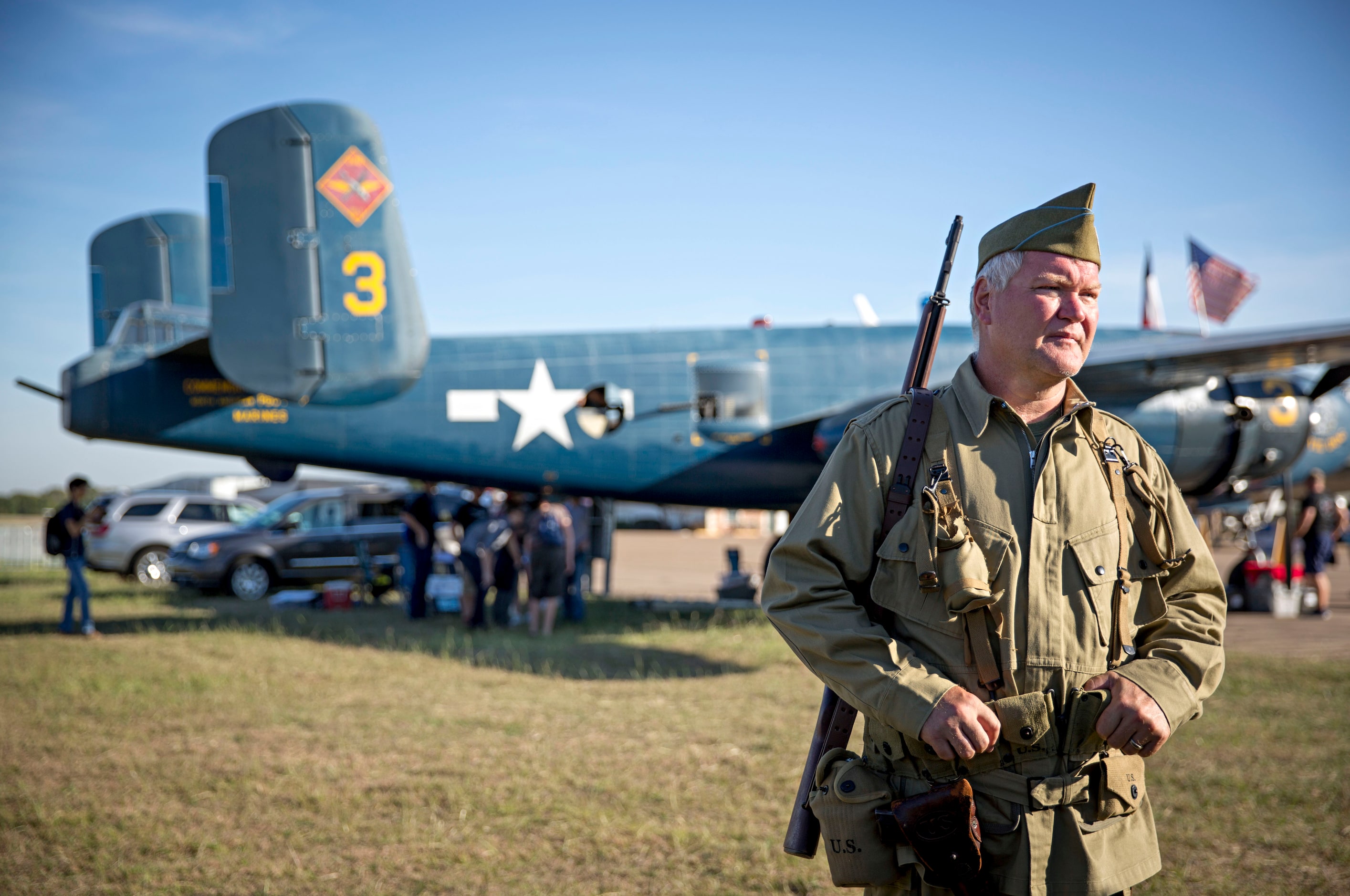 Tim Chetwynd, a World War II re-enactor with the 502nd Parachute Infantry Regiment, looks on...