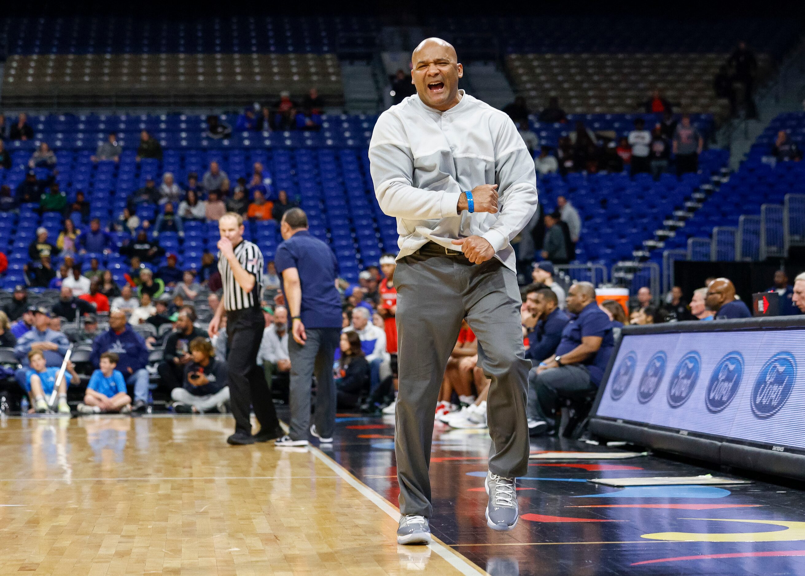 Duncanville head coach David Peavy celebrates after Duncanville forced a turnover during the...