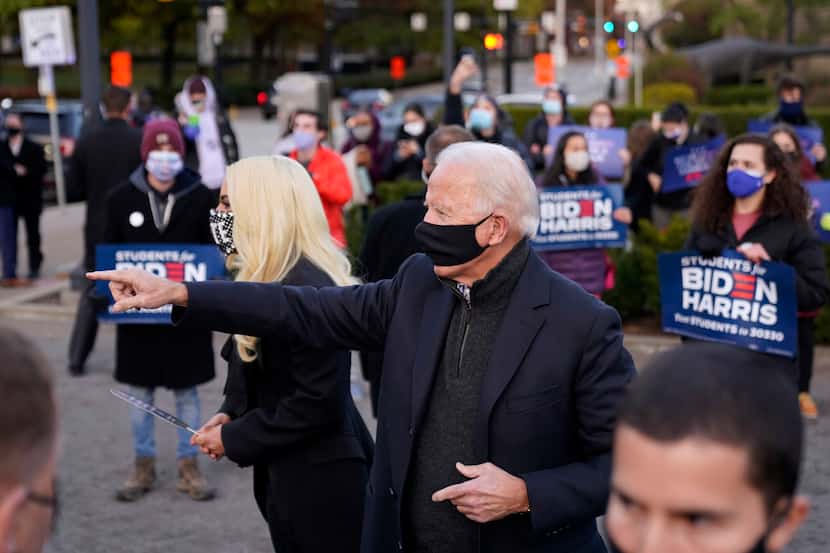 Former Vice President Joe Biden stands with Lady Gaga at Schenley Plaza in Pittsburgh, Pa.,...