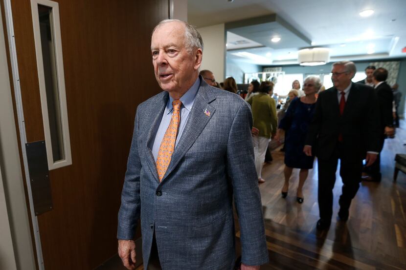 T. Boone Pickens leaves after a dedication ceremony at T. Boone Pickens Hospice and...