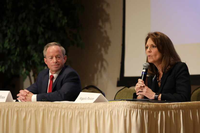 Candidates Phillip Huffines, left, and Angela Paxton discuss their views during a candidate...
