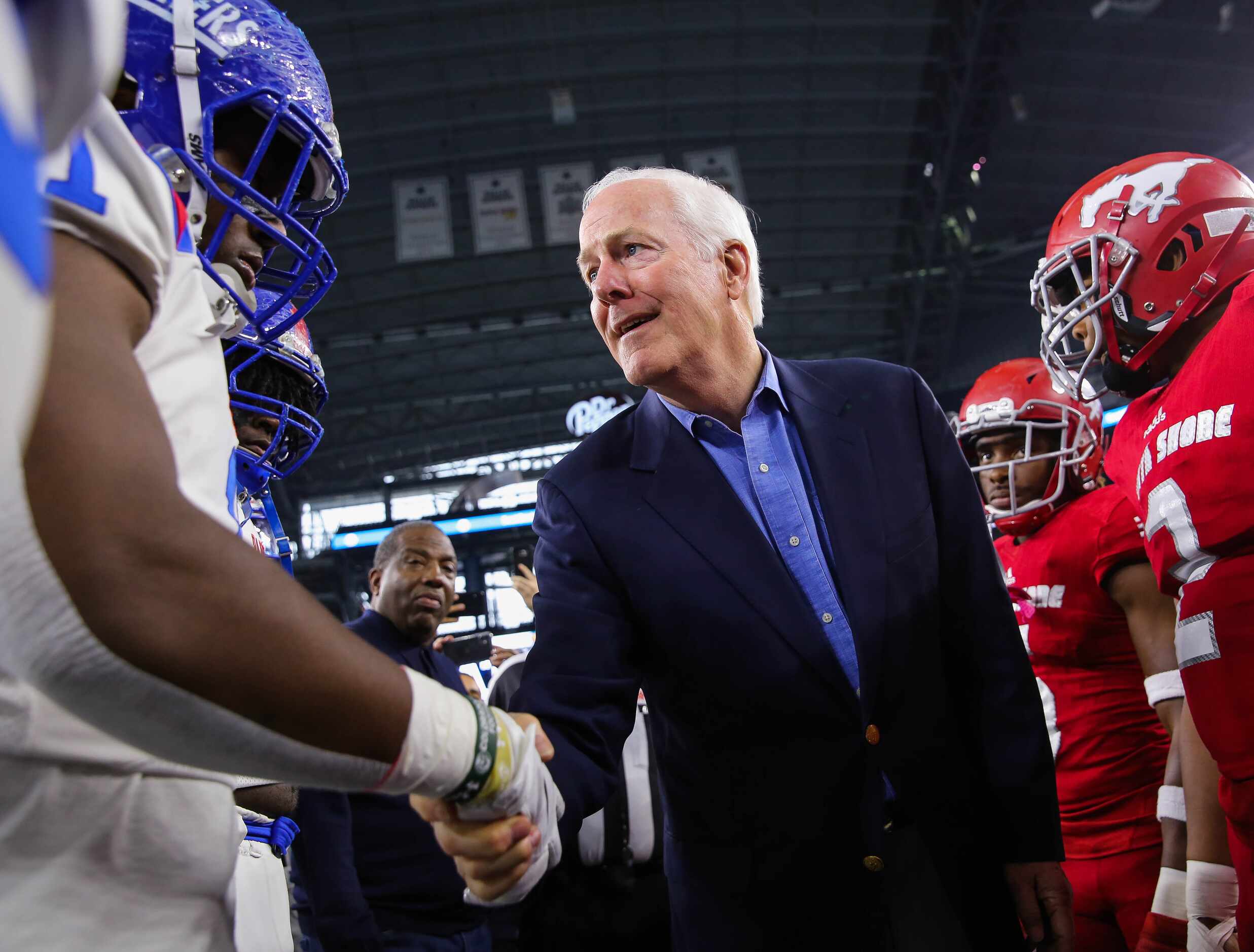 Duncanville players shake hands with U.S. Sen. John Cornynbegore a Class 6A Division I state...
