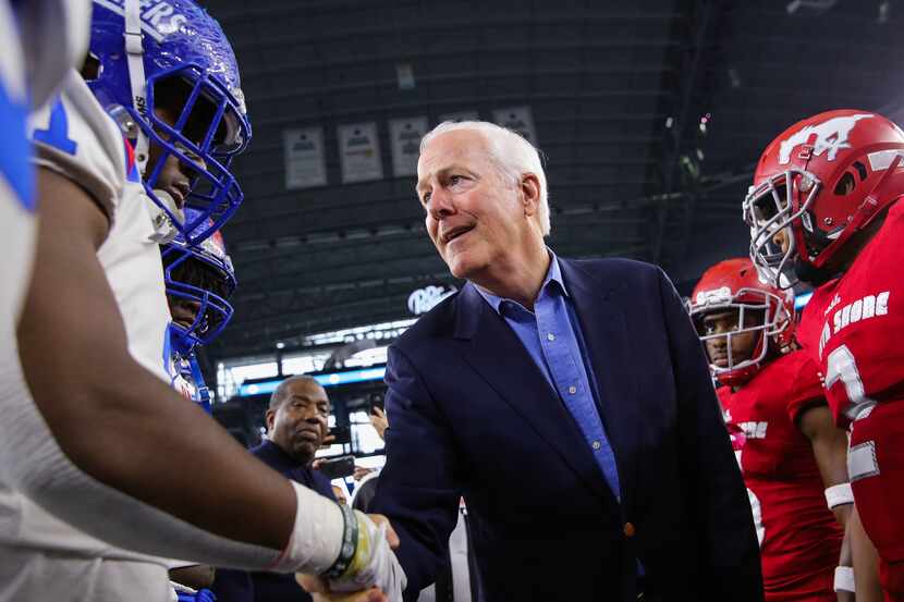Duncanville players shake hands with U.S. Sen. John Cornyn before a Class 6A Division I...