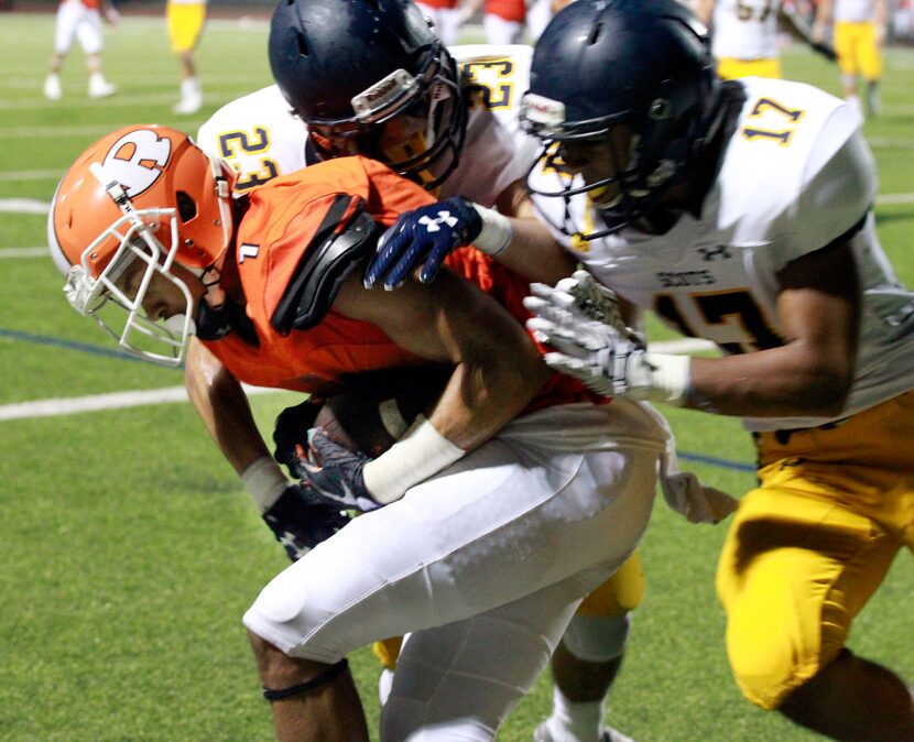 Rockwall Cameron Crayton (1) grabs the winning TD pass as Highland Park defenders Grayson...