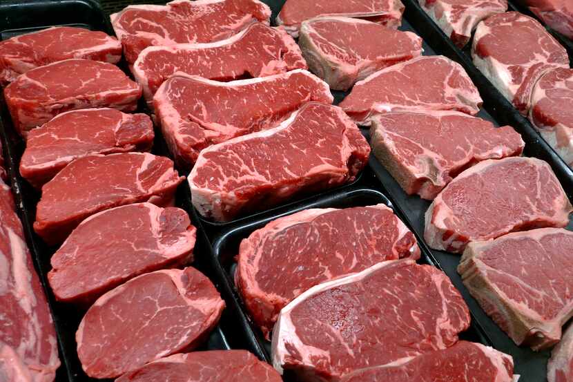 File photo of steaks and other beef products at the supermarket. Based on wholesale prices,...