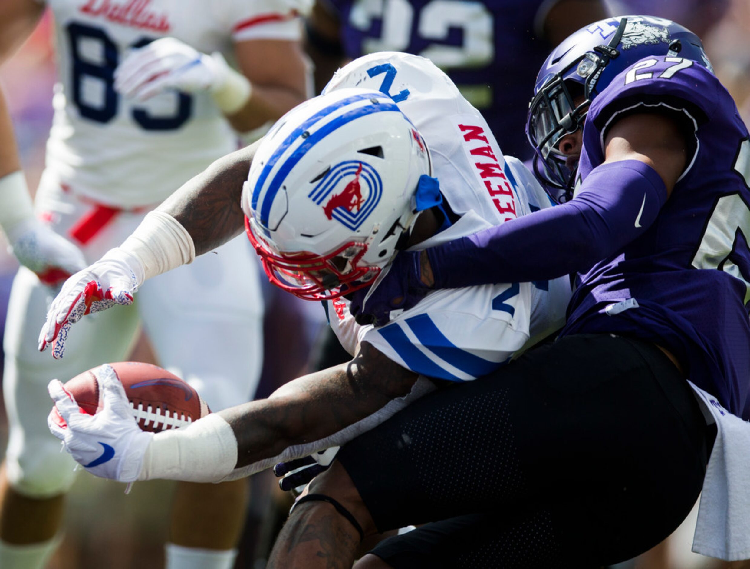 Southern Methodist Mustangs running back Ke'Mon Freeman (2) reaches across the goal line for...