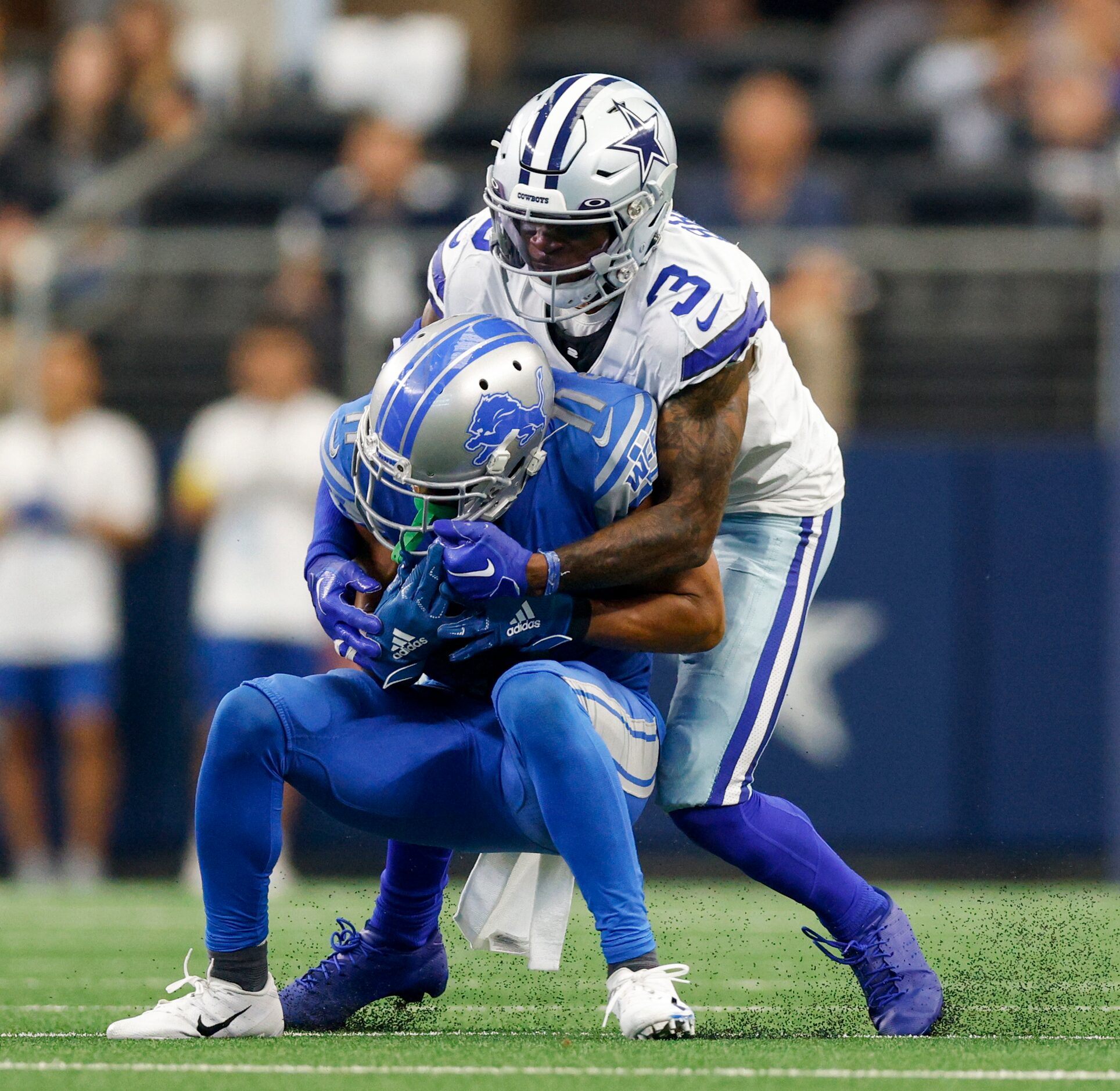 Dallas Cowboys cornerback Anthony Brown (3) tackles Detroit Lions wide receiver Kalif...