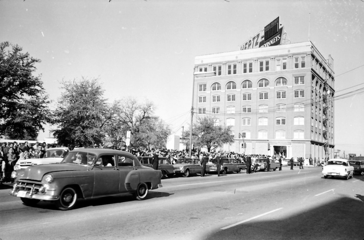 November 23, 1963 - Crowds along Houston Street waiting to see Lee Harvey Oswald transferred...