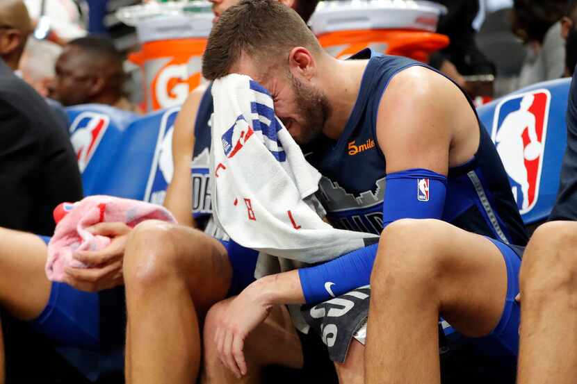 Dallas Mavericks guard J.J. Barea (5) sits on the bench in the final moments of their...