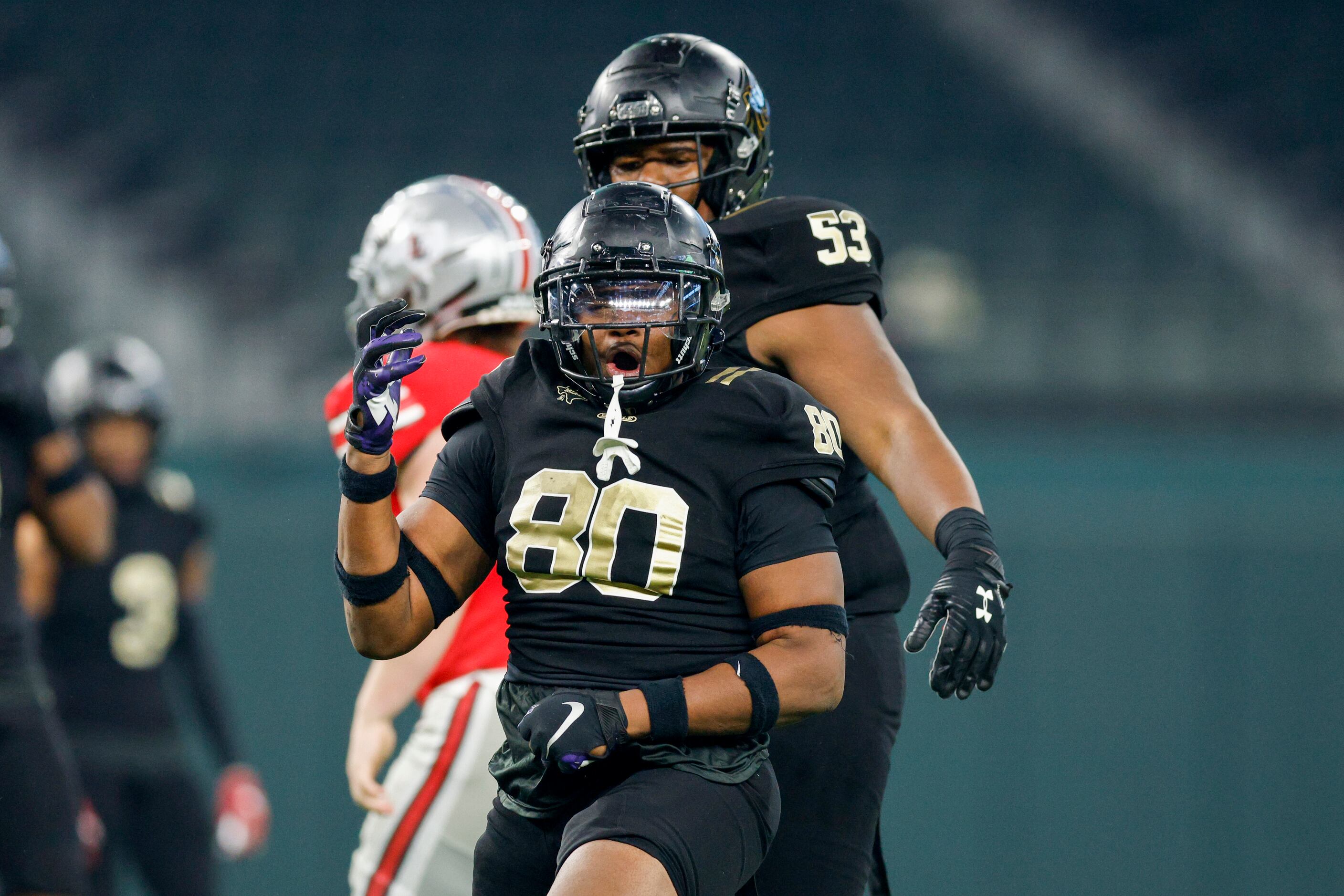 South Oak Cliff defensive lineman Keith Smith (80) celebrates after a sack during the first...