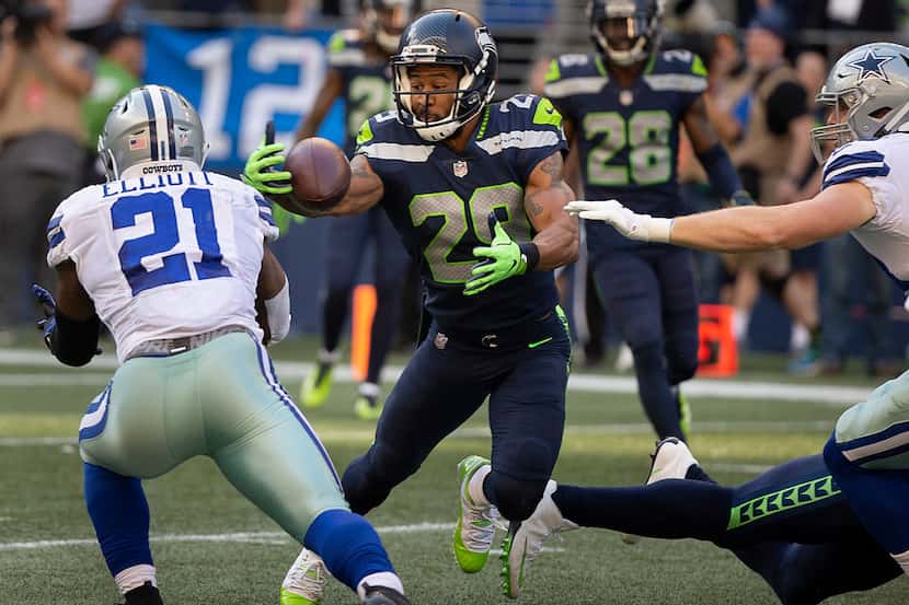 Seattle Seahawks defensive back Earl Thomas (29) intercepts a pass off the hands Dallas...