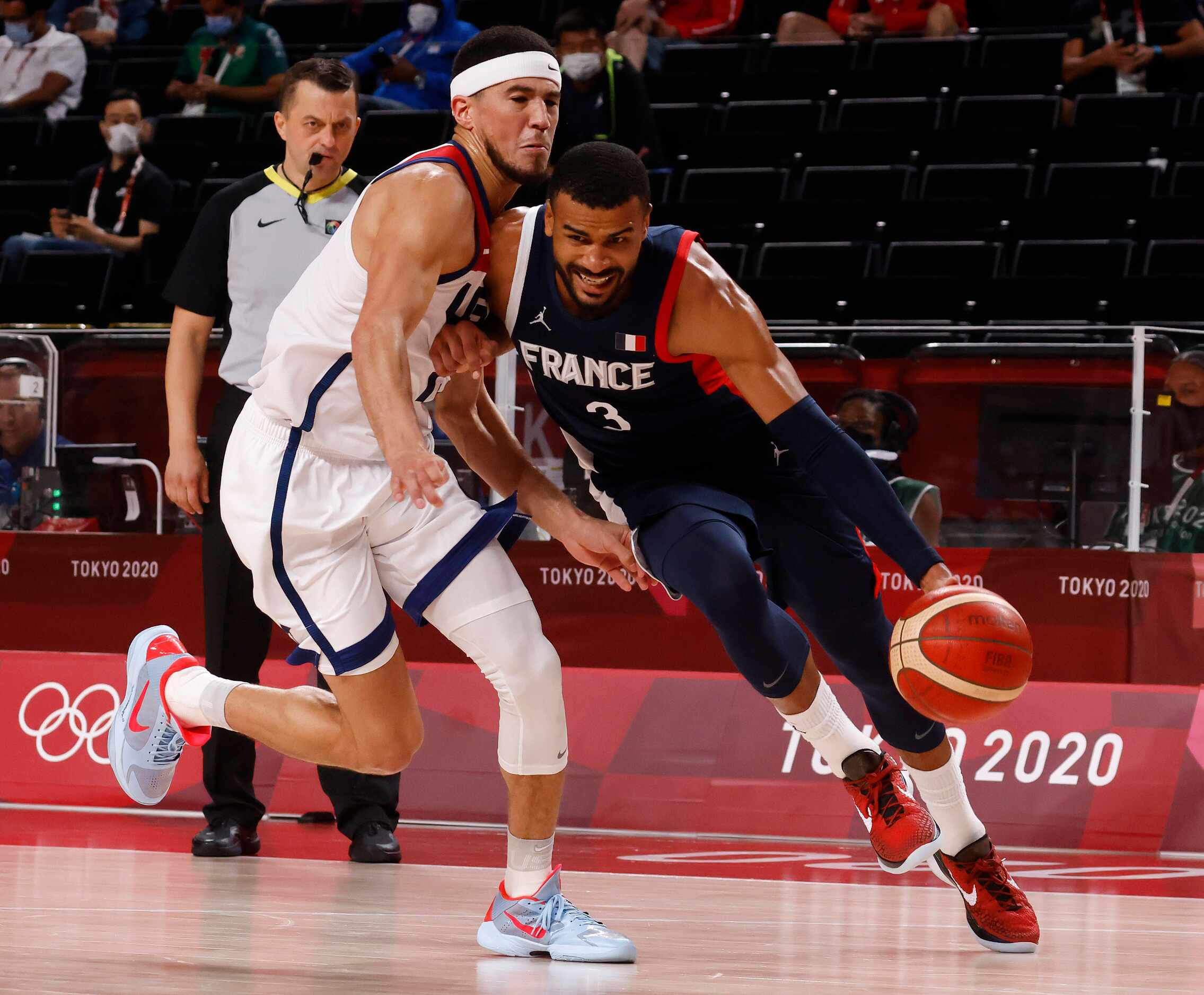 France’s Timothe Luwawu Cabarrot (3) fouls USA’s Devin Booker (15) during the second half of...