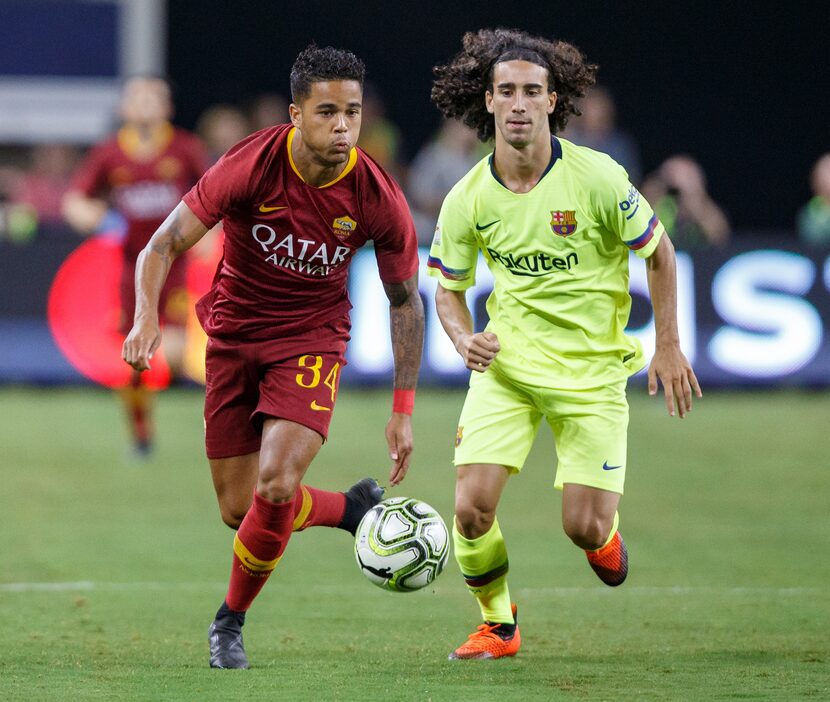 ARLINGTON, TX - JULY 31: Roma forward Justin Kluivert (#34) dribbles up field as Barcelona...