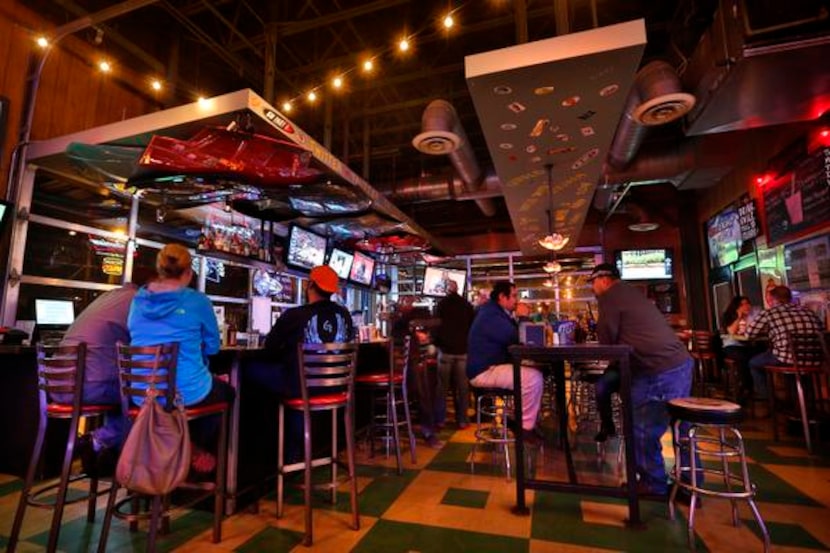 
Final Four Restaurant reviews: Patrons gather around the Grease Monkey bar on North...