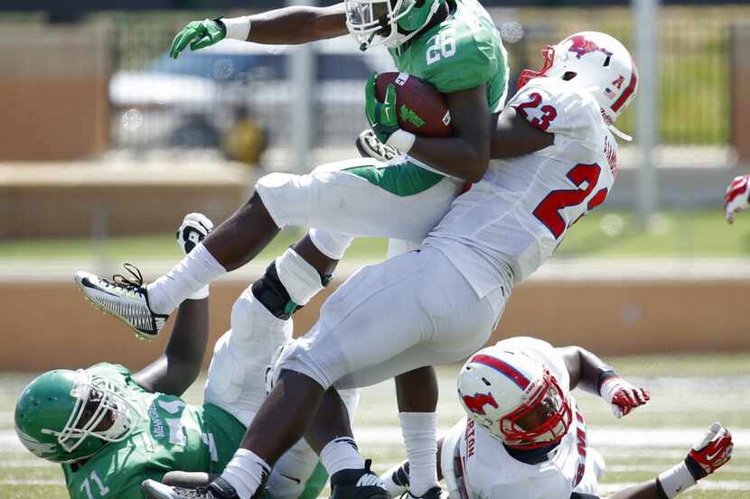 UNT running back Jeffrey Wilson carries the ball last season in a win over SMU at Apogee...