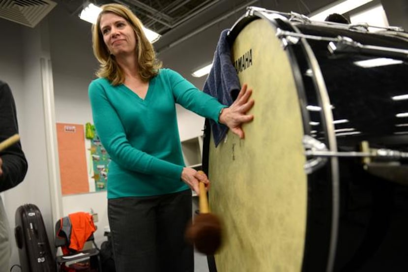 Cynthia Walker, a Carrollton Wind Symphony member, rehearses at Dan F. Long Middle School in...