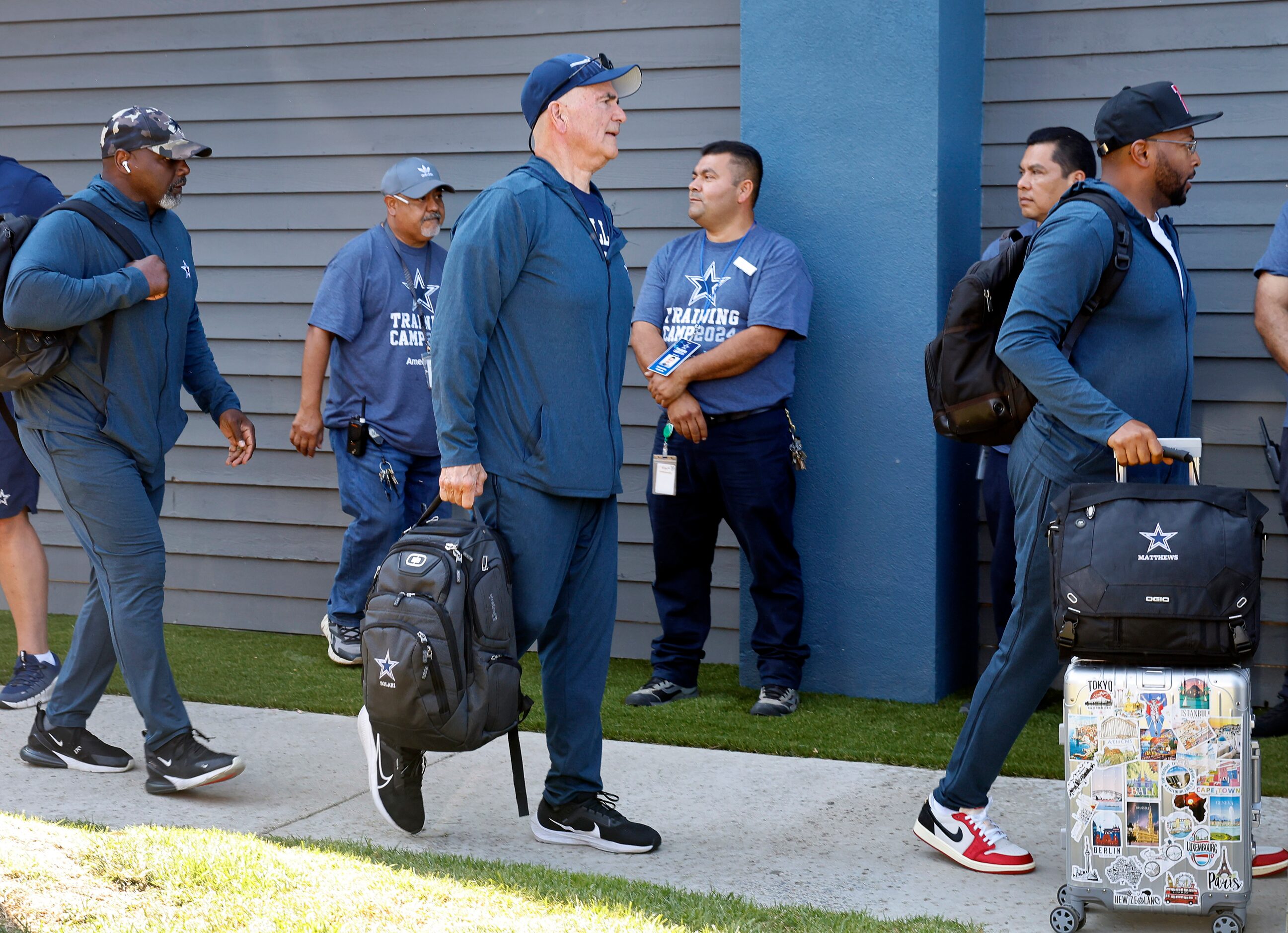 Dallas Cowboys new defensive coordinator Mike Zimmer (center) arrives with players, coaches...