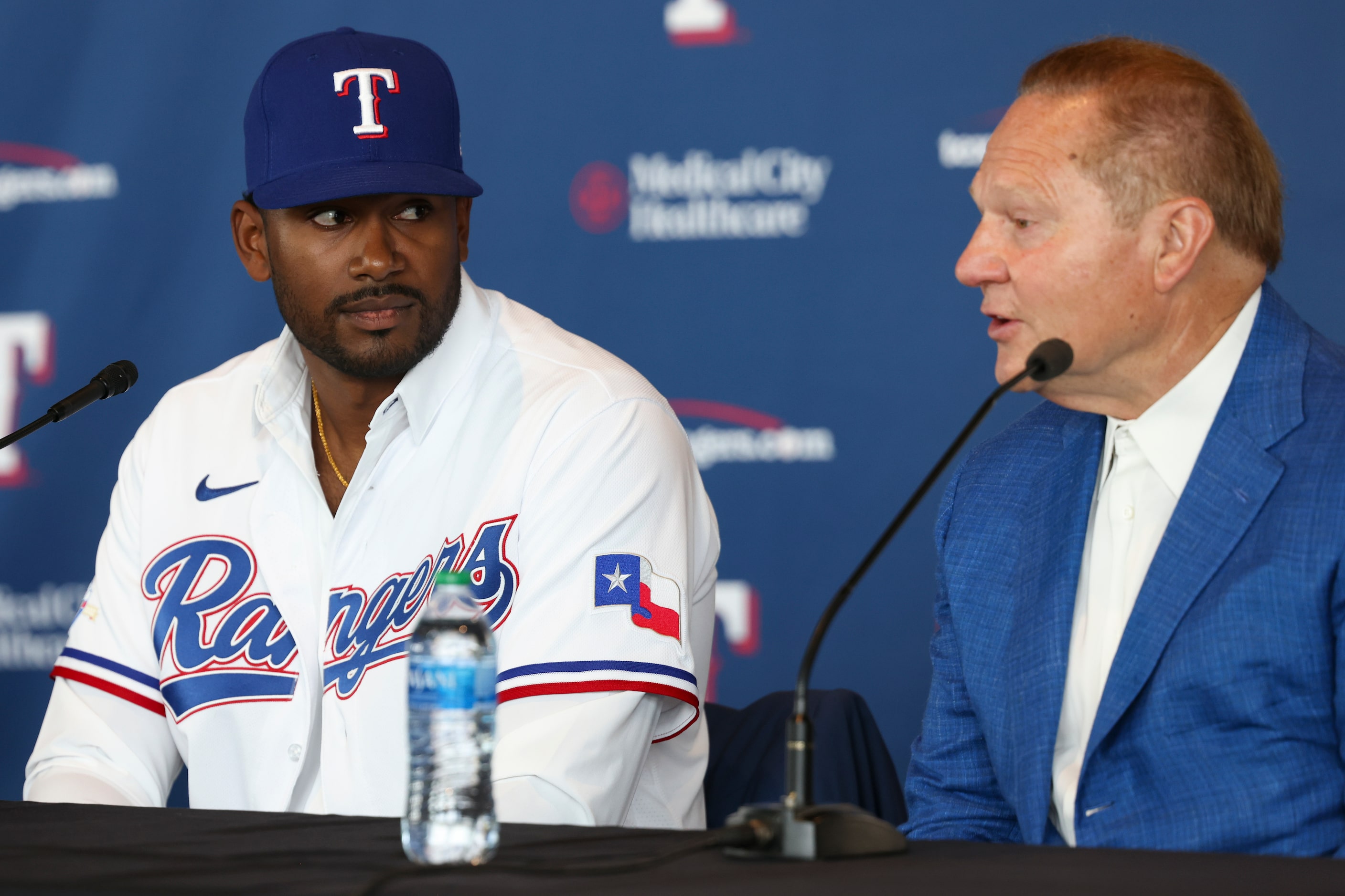 Kumar Rocker, first-round draft pick, listens as Sports Agent Scott Boras answers a media...