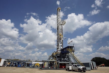 A drilling rig operates in the Barnett Shale in Flower Mound, Texas, on July 19, 2010. 