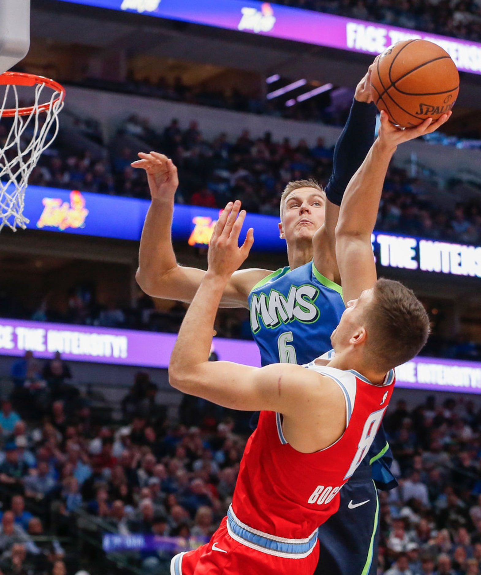 Dallas Mavericks forward Kristaps Porzingis (6) blocks a shot by Sacramento Kings guard...