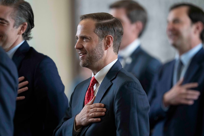 State Rep. Dustin Burrows, R-Lubbock, says the Pledge of Allegiance during the opening of...