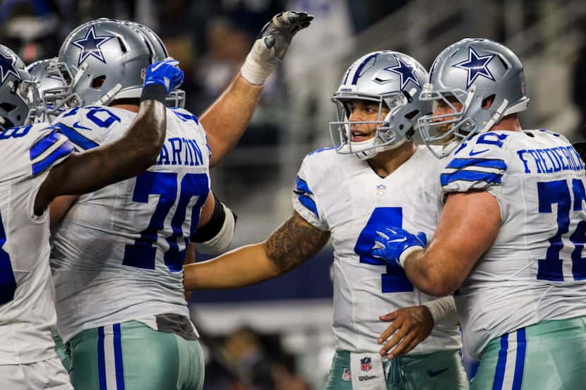 Dallas Cowboys quarterback Dak Prescott (4) celebrates a touchdown during the second quarter...