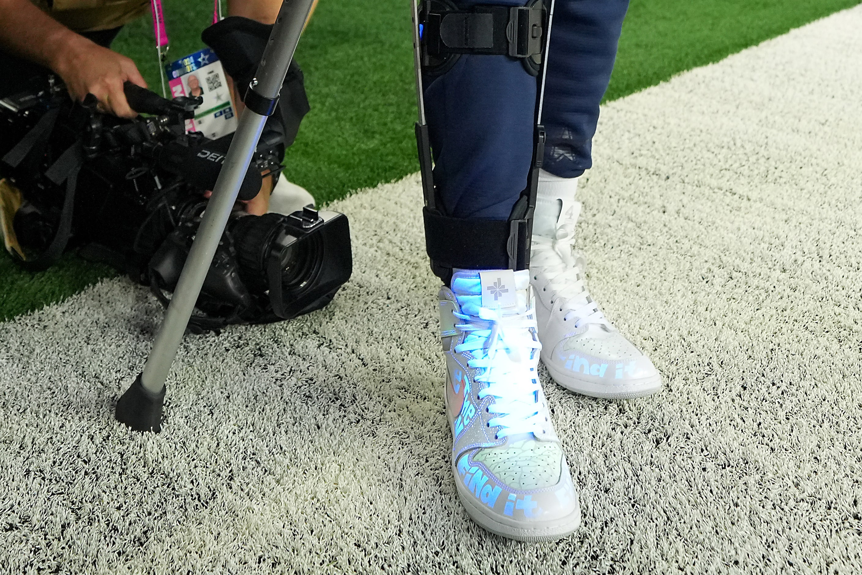 Dallas Cowboys quarterback Dak Prescott shows off his cleats for “NFL My Cause My Cleats” to...