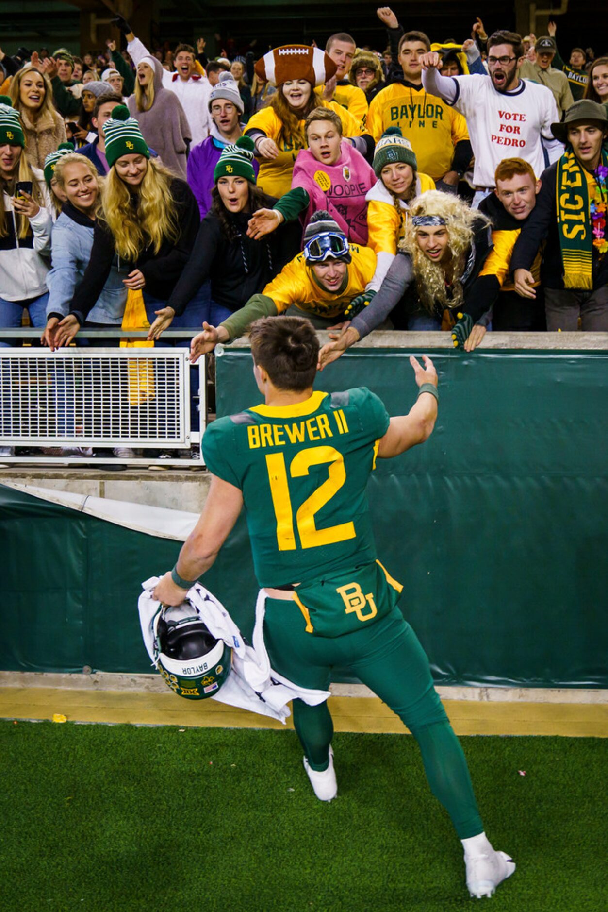 Baylor quarterback Charlie Brewer (12) celebrates with fans after a victory over West...