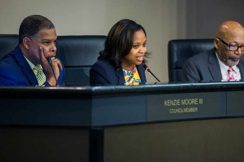 DeSoto Councilwoman Candice Quarles, middle, benefited from her husband's theft of tax...