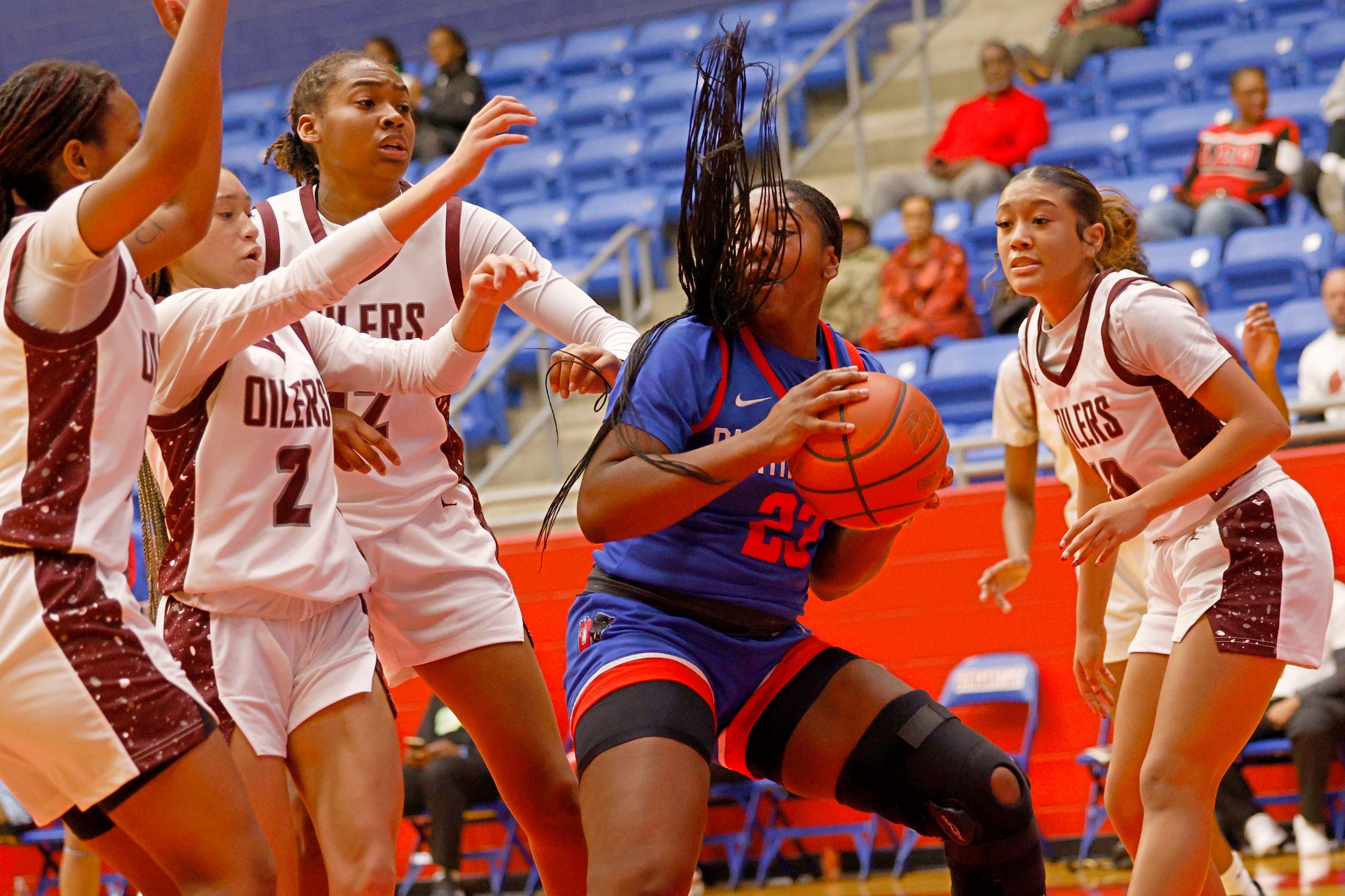 Duncanville's Trystan James (23) keeps the ball away from Pearland’s players during the...