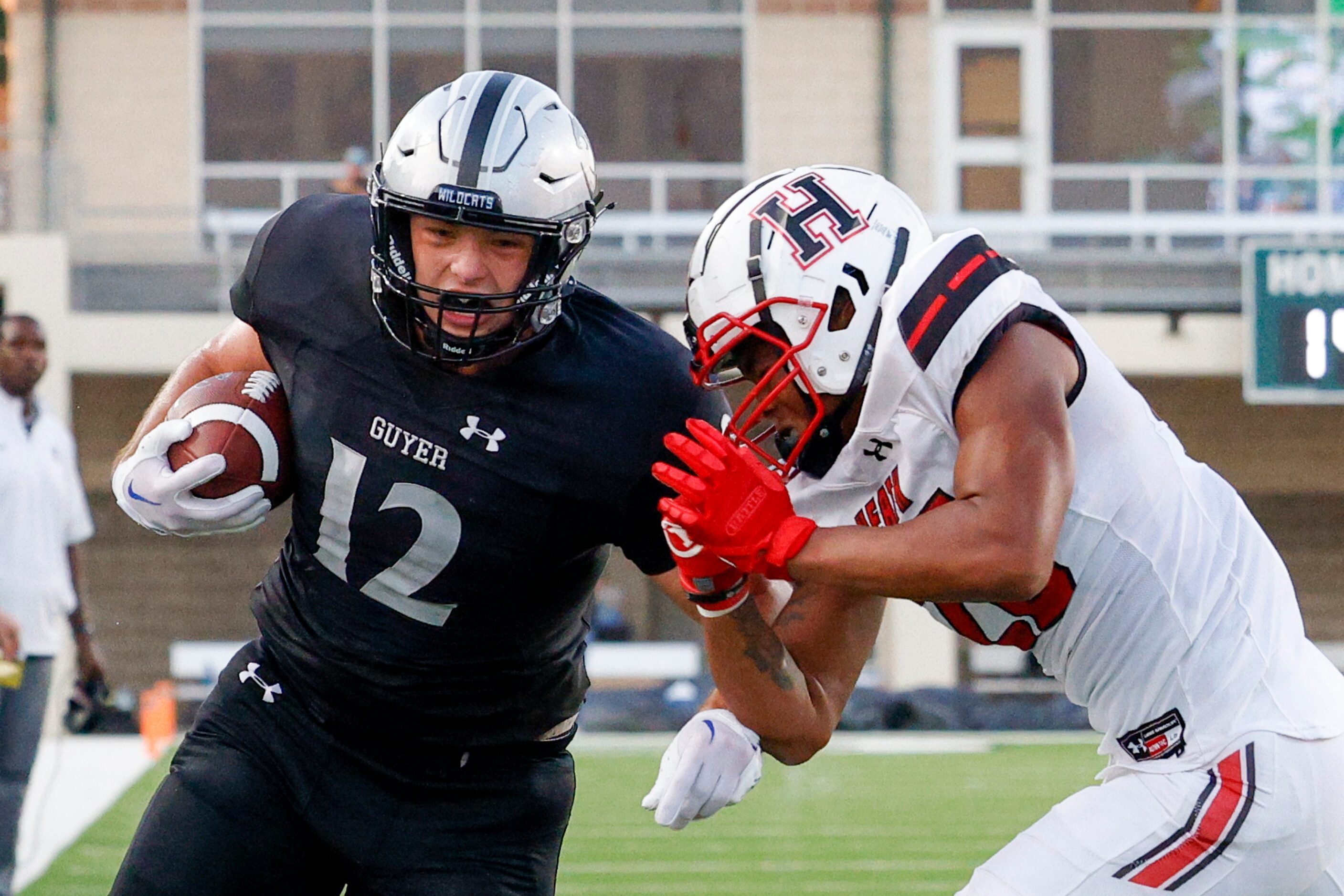 Rockwall-Heath defensive back Charles Jordan (28) forces Denton Guyer tight end Si Stovall...