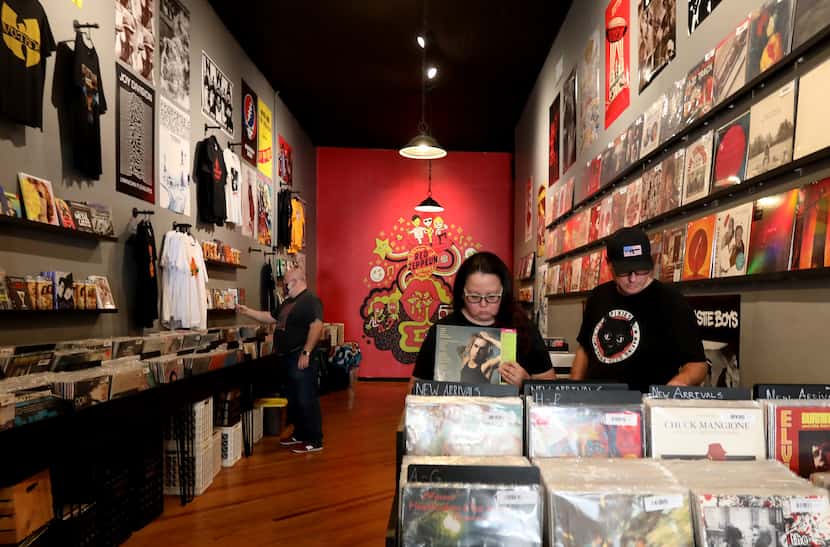 Ben and Rose Sloma look through records at Red Zeppelin, a record store in downtown McKinney.