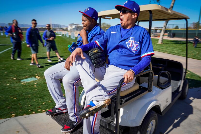 Texas Rangers pitcher Jesse Chavez (30) laughs with pitcher Edinson Volquez (36) as they...